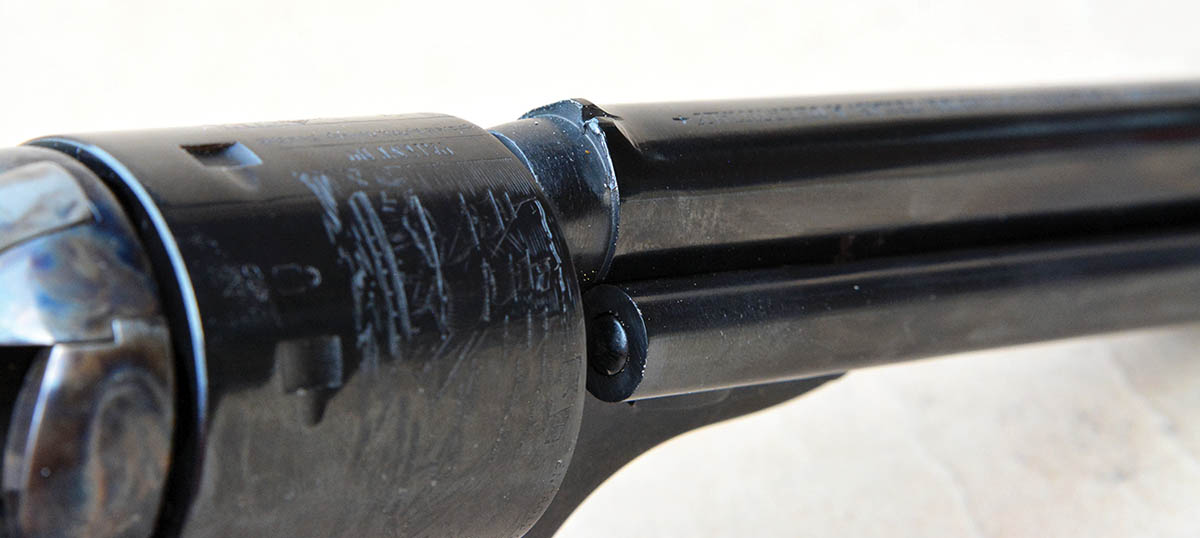 The V-notch style rear sight is machined as part of the barrel.